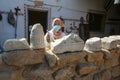 Palestinian cleans artifacts at the museum, while the Ministry of Tourism announced the closure of tourist places due to the outbr