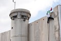 Palestinian climbs Israeli separation wall Royalty Free Stock Photo