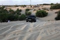 Palestinian drivers show their skills as they drive sandy hills