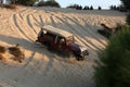 Palestinian drivers show their skills as they drive sandy hills