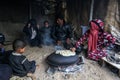 Palestinian family inside their home after heavy rain in a poor neighborhood