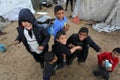 Palestinian family inside their home after heavy rain in a poor neighborhood