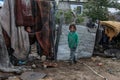 Palestinian family inside their home after heavy rain in a poor neighborhood