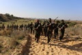 Palestinian fighters take part during a military drill carried by armed groups