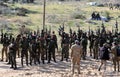 Palestinian fighters take part during a military drill carried by armed groups