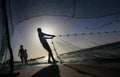 Palestinian fishermen gather their nets at the beach