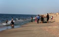 Palestinian fishermen gather their nets at the beach