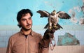 Palestinian man, loves to raise dangerous snakes and hawks at his home