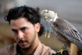 Palestinian man, loves to raise dangerous snakes and hawks at his home