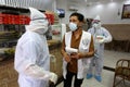 Palestinian medical workers take a random swab samples to check the Coronavirus Covid-19, from a shop owners