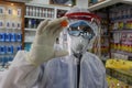 Palestinian medical workers take a random swab samples to check the Coronavirus Covid-19, from a shop owners