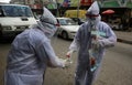 Palestinian medical workers take a random swab samples to check the Coronavirus Covid-19, from a shop owners