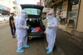 Palestinian medical workers take a random swab samples to check the Coronavirus Covid-19, from a shop owners