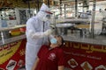 Palestinian medical workers take a random swab samples to check the Coronavirus Covid-19, from a shop owners