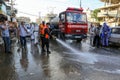 Palestinian municipality and civil defense employees organize a street cleaning and sterilization campaign in light of the coronav