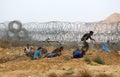 Palestinian protesters clash with Israeli soldeirs during a demonstration near the border with Israel