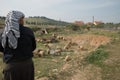 Palestinian shepherd near Israeli settlement Royalty Free Stock Photo