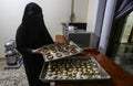 Palestinian women make sweets and traditional cakes in preparation for the blessed Eid Al-Adha feast