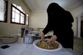 Palestinian women prepare traditional cakes to celebrate the advent of the blessed Eid al-Fitr