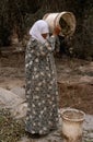 A Palestinian women working in an olive grove, Palestine.
