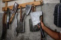 Palestinian worker sharpens a knife that will be used to slaughter cattle during the Muslim festival of sacrifice Eid al-Adha