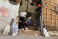 Palestinian worker sharpens a knife that will be used to slaughter cattle during the Muslim festival of sacrifice Eid al-Adha