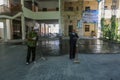 A Palestinian worker wearing a protective face mask sanitises a classroom in school a before a new academic year starts, amid conc