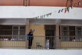 A Palestinian worker wearing a protective face mask sanitises a classroom in school a before a new academic year starts, amid conc