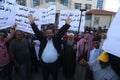 Palestinians attend a protest demanding UNRWA to pay Palestinian families for the repair of their homes, damaged during the 2014 I