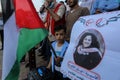 Palestinians, carry placards demanding the release of administrative detainee in Israeli custody Maher al-Akhras