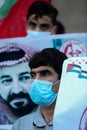 Palestinians, carry placards demanding the release of administrative detainee in Israeli custody Maher al-Akhras