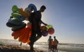 Palestinians enjoy the beach of the sea