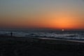 Palestinians enjoy themselves on the beach during sunset, in Gaza Strip