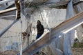 Palestinians inspect the damage at the site of an Israeli air strike