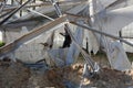 Palestinians inspect the damage at the site of an Israeli air strike