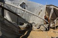 Palestinians inspect the damage at the site of an Israeli air strike