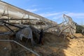 Palestinians inspect the damage at the site of an Israeli air strike