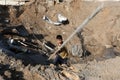 Palestinians inspect a seaport after an Israeli airstrike in the southern Gaza Strip