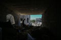 Palestinians inspect their destroyed houses by recent Israeli air strikes in the Gaza Strip