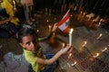 Palestinians light candles to show solidarity with the Lebanese people following Tuesday`s blast in Beirut`s port area