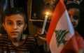 Palestinians light candles to show solidarity with the Lebanese people following Tuesday`s blast in Beirut`s port area