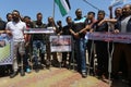 Palestinians participate in a march rejecting the policy of the Israeli annexation project in the West Bank and the Jordan Valley