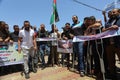 Palestinians participate in a march rejecting the policy of the Israeli annexation project in the West Bank and the Jordan Valley