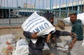 Palestinians receive their food rations from United Nations Relief and Works Agency UNRWA