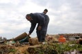 Palestinians salvage belongings from the site of an Israeli airstrike