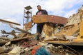 Palestinians salvage belongings from the site of an Israeli airstrike