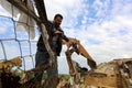 Palestinians salvage belongings from the site of an Israeli airstrike