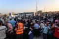 Palestinians wait to cross over to the Egyptian side of the Rafah border crossing