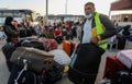 Palestinians wait to cross over to the Egyptian side of the Rafah border crossing