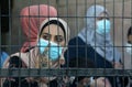 Palestinians wait to cross over to the Egyptian side of the Rafah border crossing